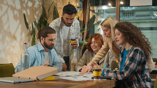 istock Multiethnic group creative pet dog friendly office coworking diverse team designers colleagues freelance coworkers business men women happy girls guys students friends talk study project drink coffee 2211711545