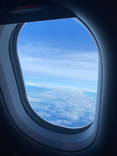 istock View from Airplane Window of Blue Sky and Clouds 2211712200