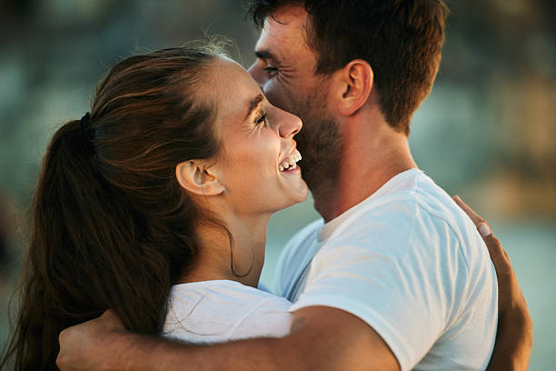 istock Young happy couple enjoying in a hug. 2211712309
