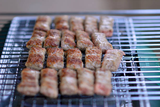 Grilled chicken wings on a barbecue grill. Close-up.
