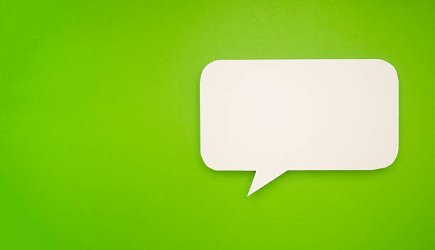 istock Blank white speech bubble on a vibrant green background. 2211713238