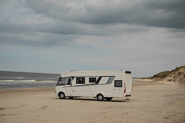 istock Camper rv caravan on North sea coast in Denmark. 2211715300