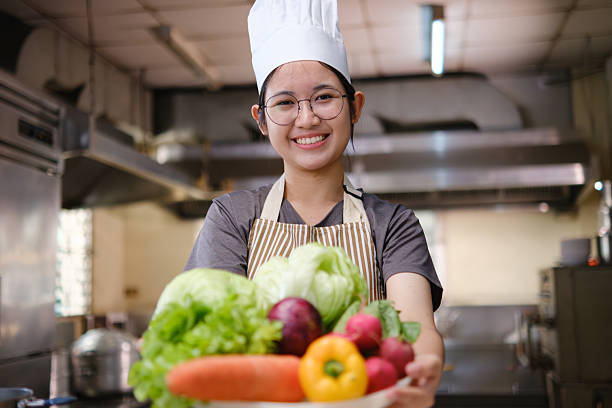 istock Happy Chef Holding Fresh Vegetables Healthy Food 2211717256