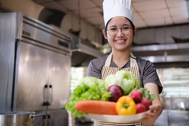 istock Happy Chef Holding Fresh Vegetables Healthy Food 2211717257