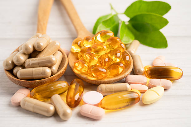 istock Alternative medicine herbal organic capsule drug herb. 2211717863