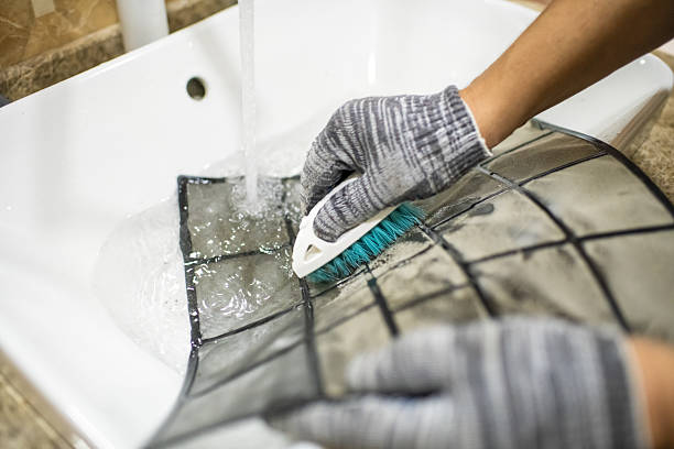 Technician cleaning air conditioner