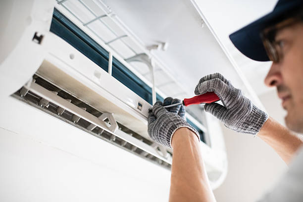 istock Technician with screwdriver repairing air conditioner at home 2211719481