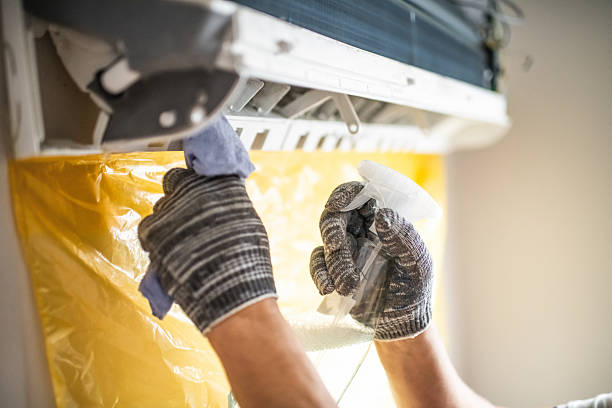 istock Technician cleaning air conditioner indoors 2211719546
