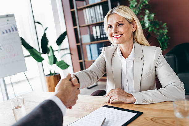 Professional handshake signifying agreement between business professionals during an office meeting focused on collaboration and teamwork