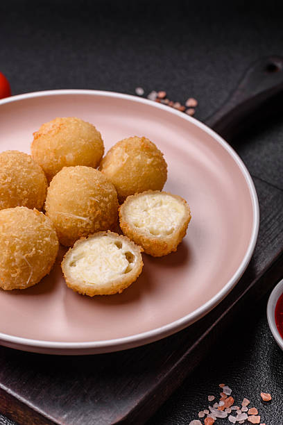Cheese fried balls or croquettes with potatoes or rice
