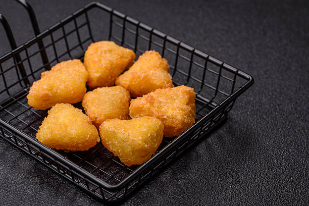 istock Fried mozzarella or brie cheese with cranberry or raspberry sauce 2211723548