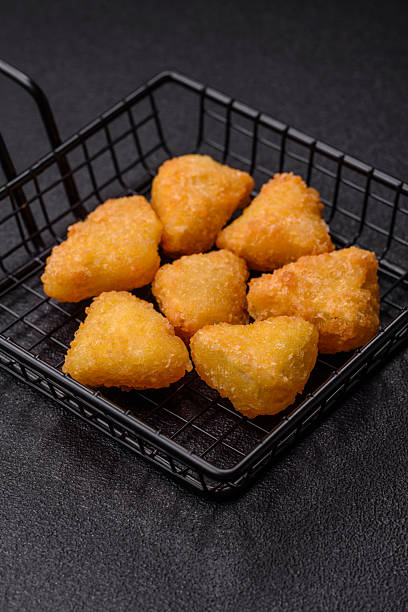 istock Fried mozzarella or brie cheese with cranberry or raspberry sauce 2211723559