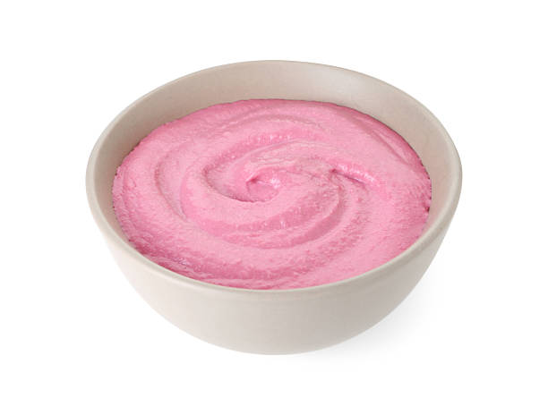 istock Tasty beetroot hummus in bowl isolated on white 2211723781