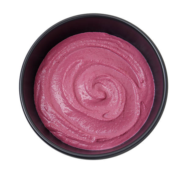 istock Tasty beetroot hummus in bowl isolated on white, top view 2211723799