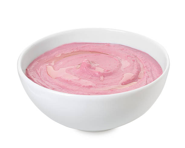 istock Tasty beetroot hummus in bowl isolated on white 2211723840