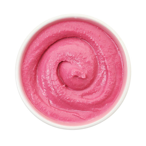 istock Tasty beetroot hummus in bowl isolated on white, top view 2211723874