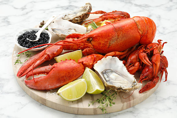 istock Many different sea food on white marble table, closeup 2211724092