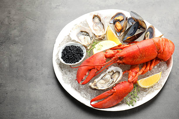 istock Many different sea food on grey table 2211724227