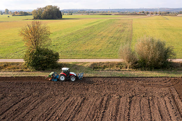 istock Tractor sowing grain in a field 2211725410