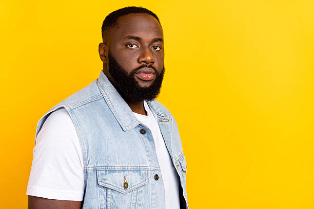 istock Profile side view portrait of attractive serious content bearded guy copy blank space isolated over bright yellow color background 2211727992