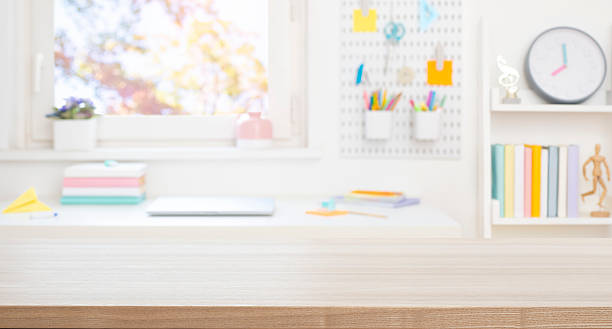 istock Blank wooden board for product display on blurred schoolchild table and room interior background 2211729089