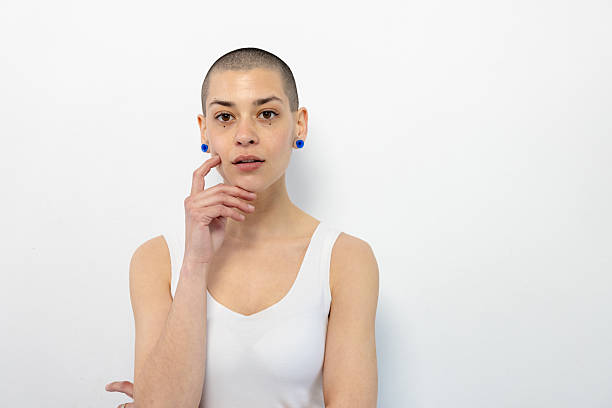 Studio portrait of a beautiful, young short - haired woman posing casually