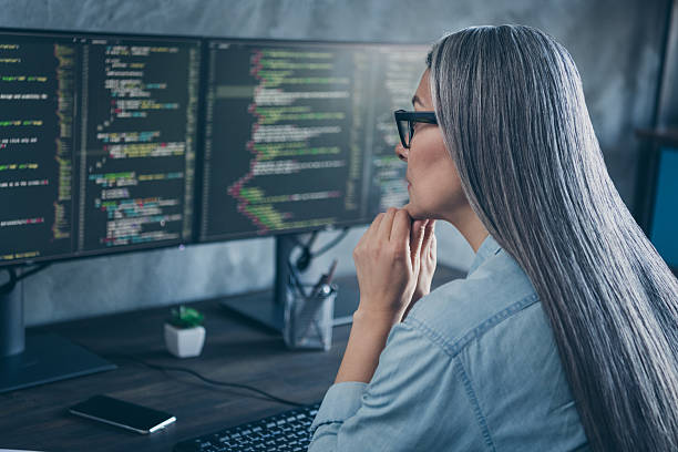 istock Photo of concentrated lady boss smart it sit desk make fast speed connection development research in workspace 2211732105