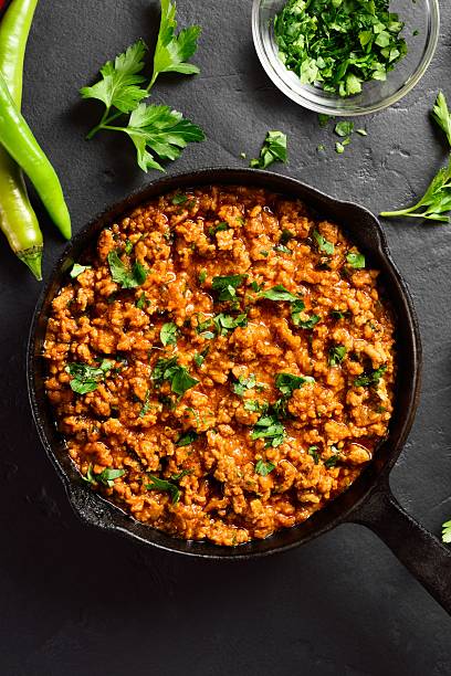 istock Indian meal Keema curry in cast iron pan 2211736512