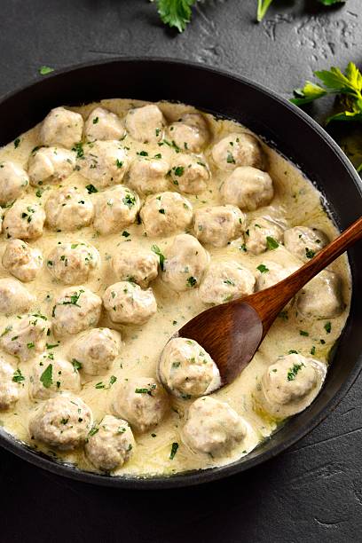 istock Swedish meatballs with white creamy sauce 2211737181