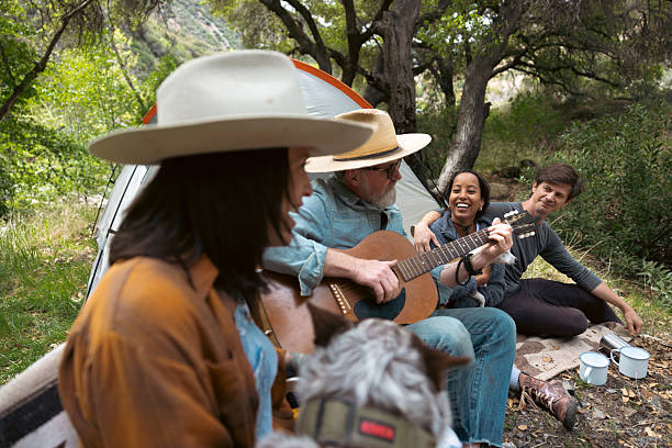 istock Group of multi ethnic friends camping in the forest 2211742371