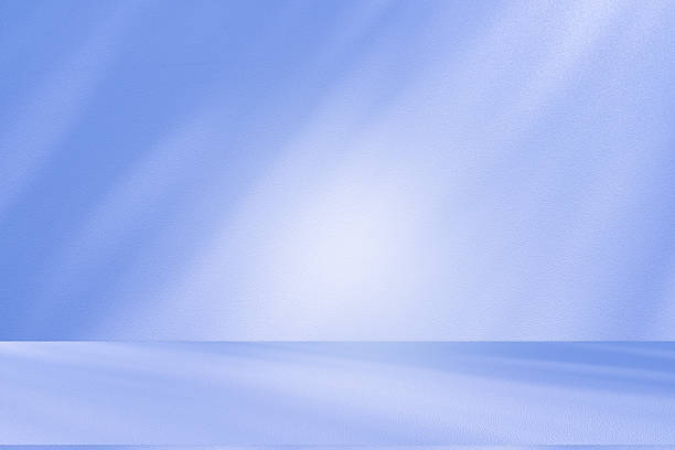 istock Studio style background wall decoration presentation uses white and blue tones. with shadows cast from a nearby window, concept creating a decorative 2211742373