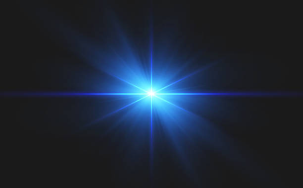 istock A vibrant image of a bright blue light source shining at the center, radiating dynamic beams against a dark background. This striking glow evokes a sense of clarity and depth, ideal for various design 2211744010