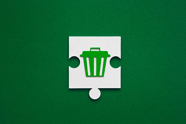 Waste Management Puzzle Piece on Green Background. waste solutions and environmental management challenges. Waste management concept. Recycling day. World clean up day. Recycling