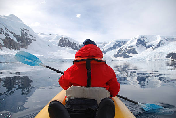 istock Kayaker paddling glacier bay Antarctica 2211744332