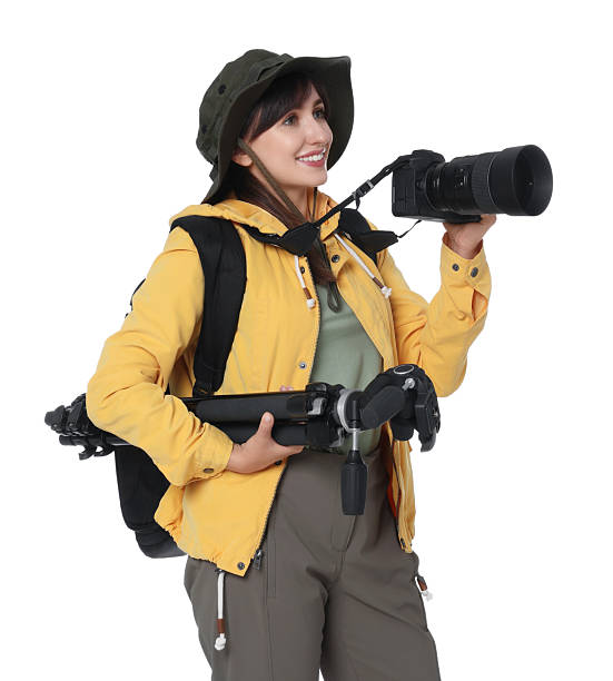 istock Photographer with backpack, camera and other professional equipment on white background 2211746194