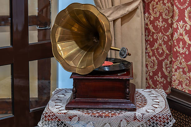 istock Vintage still life with old gramophone on the table on retro tablecloth. 2211746870