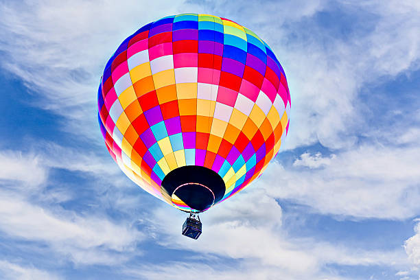 istock Hot air balloon flight over blue sky 2211747481