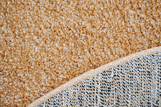 istock close-up. beige Interior pile carpet made of polypropylene. 2211747911