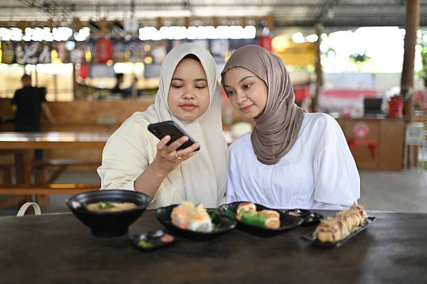 istock Asian Women Take a picture before eating 2211751974