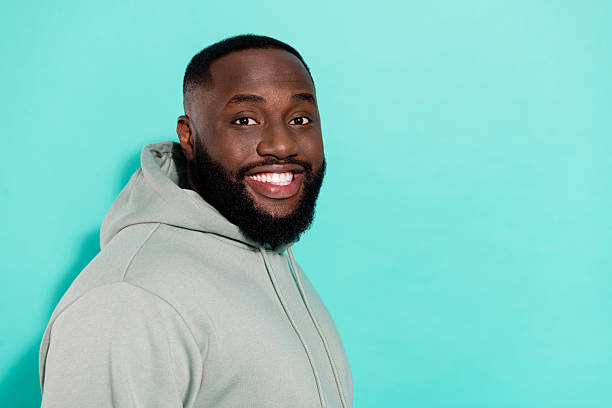 istock Profile side view portrait of attractive cheerful guy copy empty space isolated over bright teal turquoise color background 2211753689