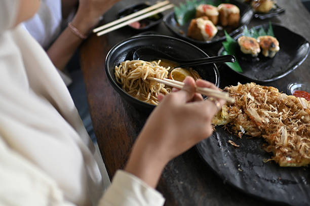 istock Asian Women  eating Sakura Ramen 2211760462
