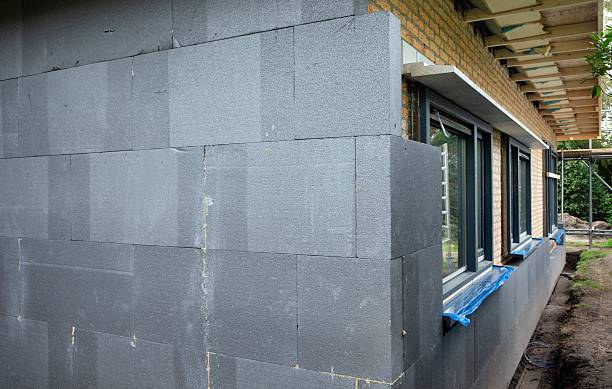 istock Insulation of a house, creating ann extra wall with styrofoam blocks. 2211761537
