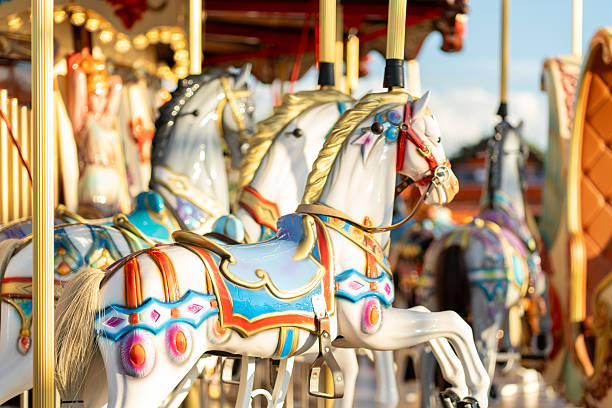 istock Colorful Carousel Horses in a Lively Amusement Park Setting During Daytime 2211762180
