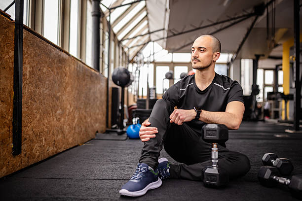 istock Young man practicing strength training at the gym for a healthy lifestyle and self-improvement 2211762709