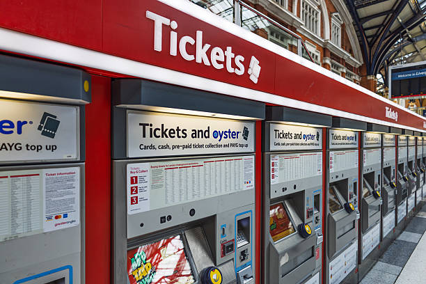 Ticket booth with bright red Tickets sign and service window in a bustling city environment. London, UK, 11 February 2024