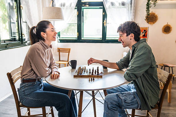 istock Young couple playing chess and having fun 2211767684