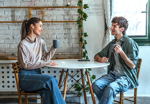 istock Young couple enjoying coffee together 2211767924