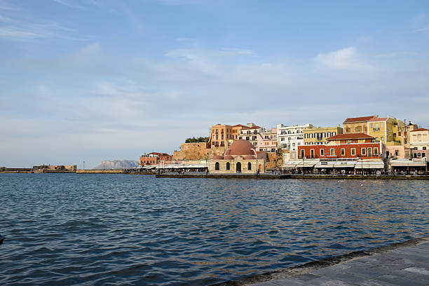 Chania Harbour, on Crete’s northwest coast, was built by the Venetians between 1320 and 1356 as a fortified naval base. It features a series of shipyard buildings (arsenali) used for maintaining galleys and a lighthouse originally constructed by the Venetians and later rebuilt by the Egyptians in the 19th century. The harbour served military and commercial functions through Venetian, Ottoman, and modern Greek periods.