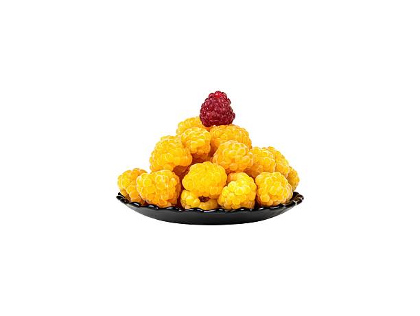 Red VIP raspberry berry with yellow berries in a plate.