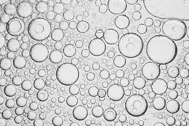 istock Texture, background, macro soda bubbles,Refreshing soda water with ice cubes against white background, closeup 2211775428